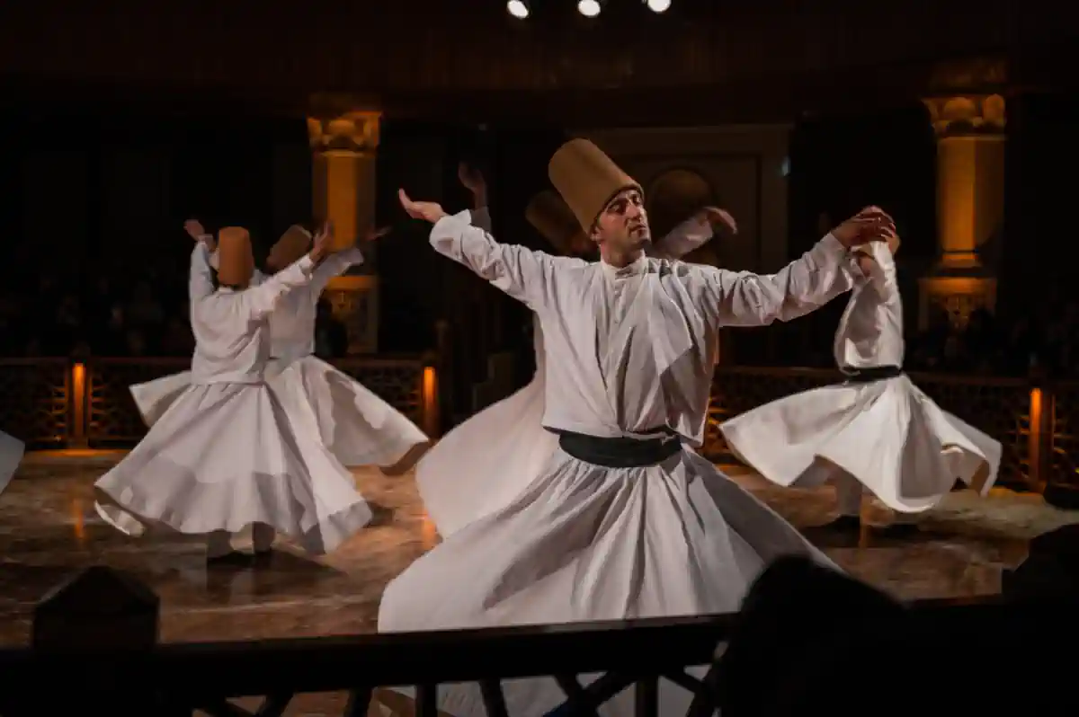 Sufi dervish in white swirling skirt performing traditional trance dance