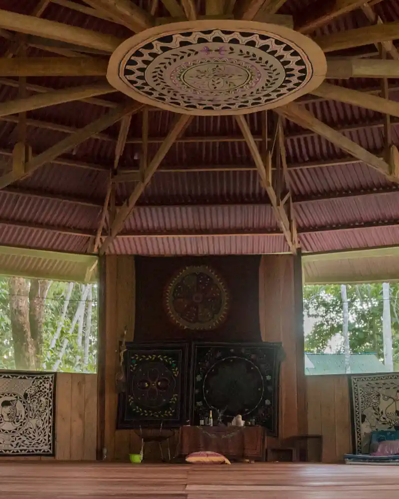 PMoloca ready for ayahuasca ceremony. Round white and black Shipibo desing in wooden rafter