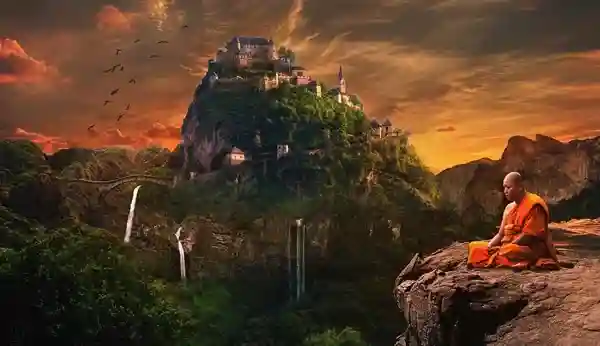 Monk meditating on a cliff overlooking a fortified mountain village with waterfalls and a dramatic orange sunset sky.